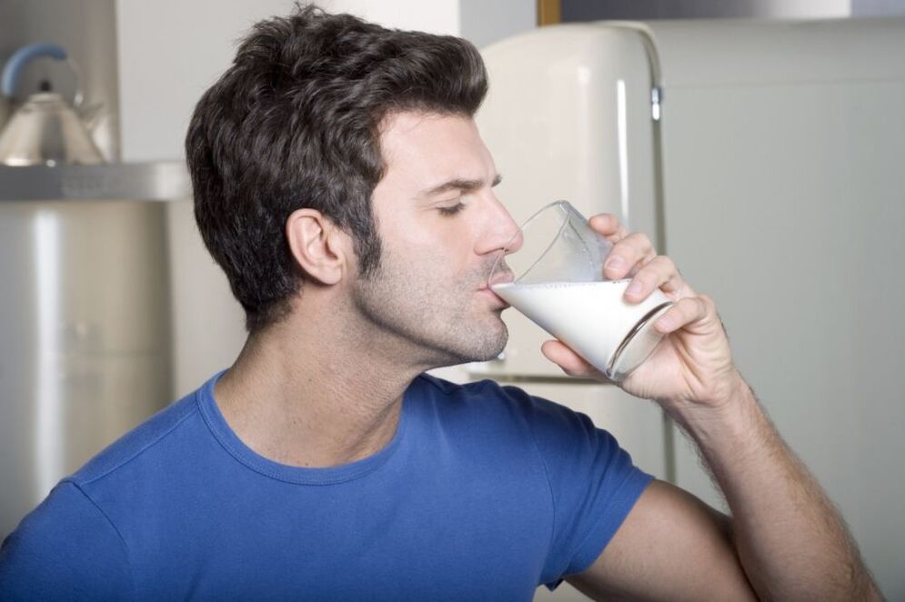 A man drinks milk
